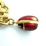 Fabergé, 18K Yellow Gold and Enamel Egg Charm Bracelet
